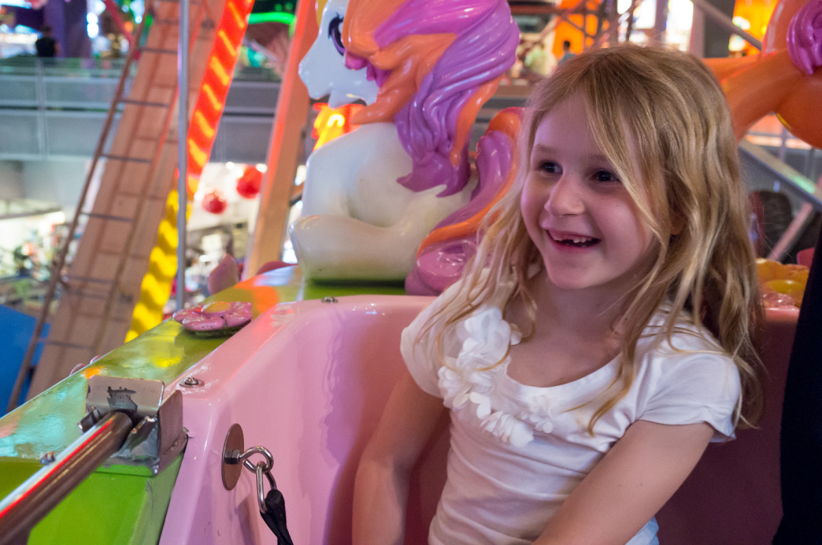 Sophia riding the ferris wheel inside Toys R Us Times Square Leica X Vario (Typ 107), 28-70mm @ 40mm, 1/60th @ f/4.6, ISO 3200